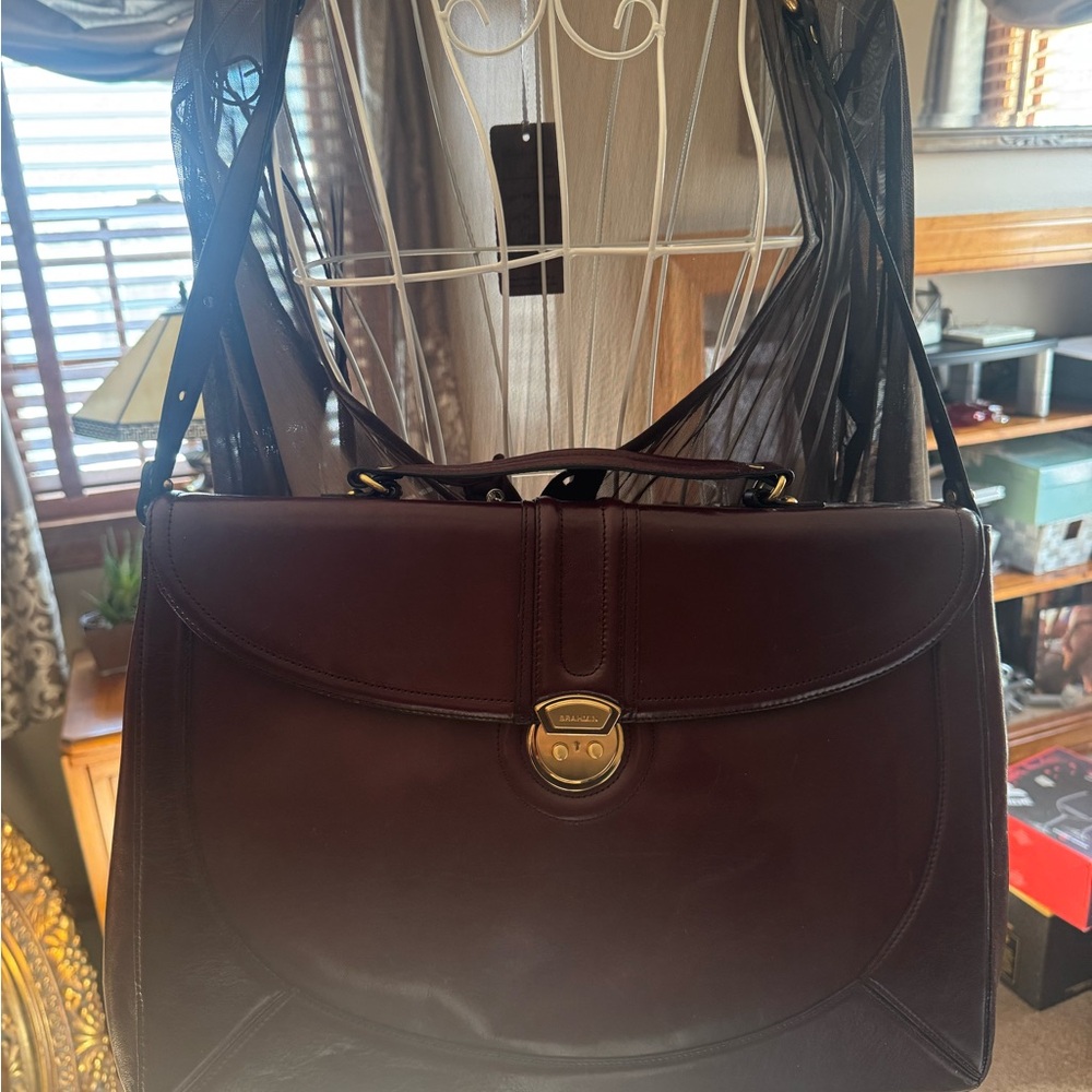Gorgeous Brahmin Burgundy Leather briefcase bag with Gold Accents. Never used.